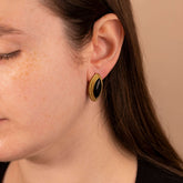 model wearing Gold stud earrings with black stone - non tarnish - waterproof