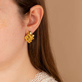 model wearing ripple effect gold stud earrings - non tarnish - waterproof