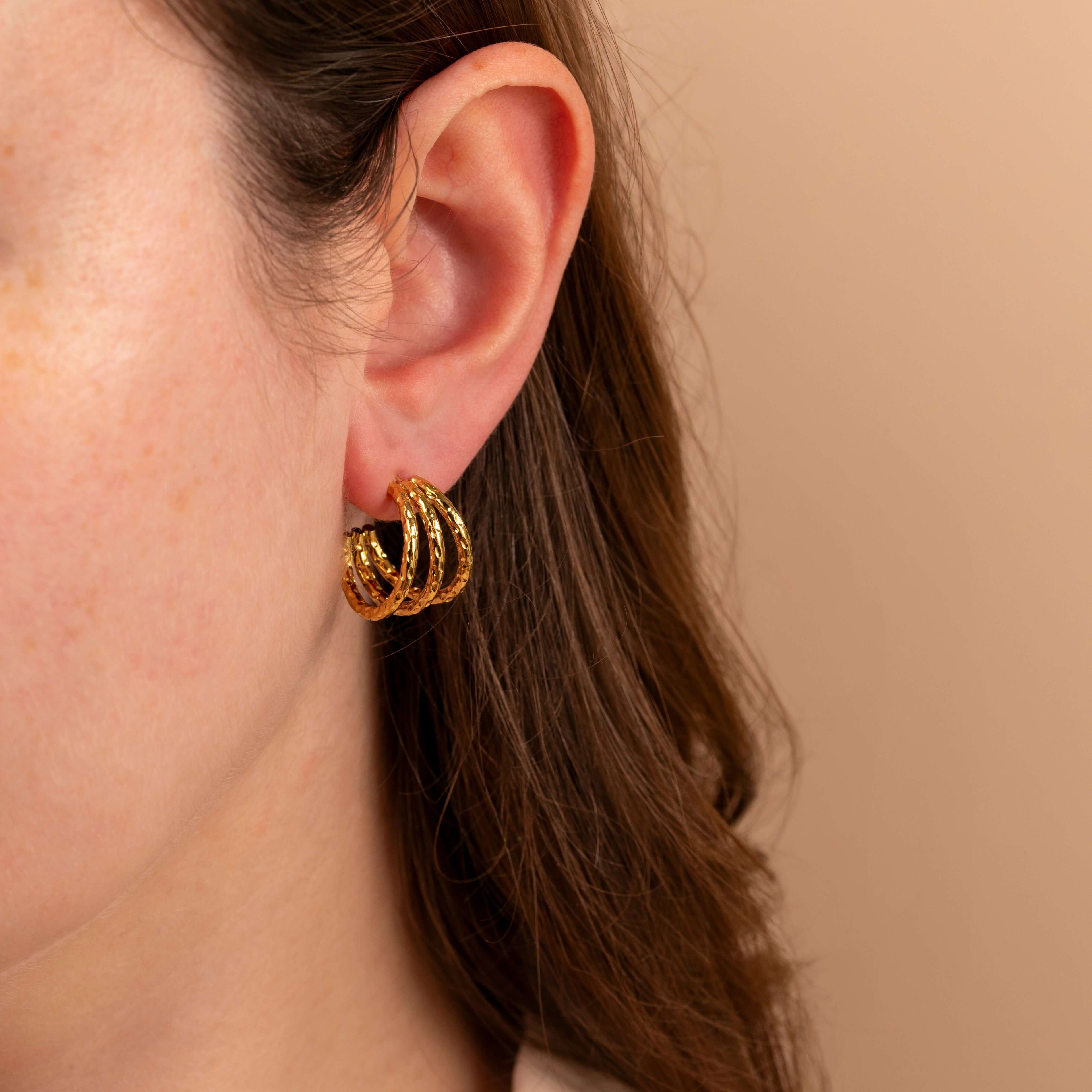 model wearing triple hammered gold hoop earrings - non tarnish - waterproof
